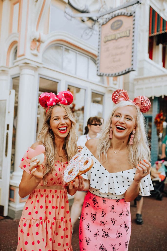 pink sequin mickey ears - two girls laughing at disney world - mickey shaped donut - magic kingdom