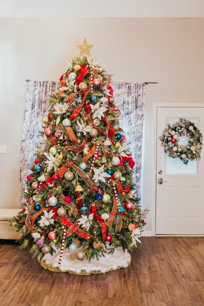 colorful christmas tree decorating ideas - red ribbon christmas tree decor - multi-colored ornaments - 9 ft christmas tree - how to decorate a small living room for christmas
