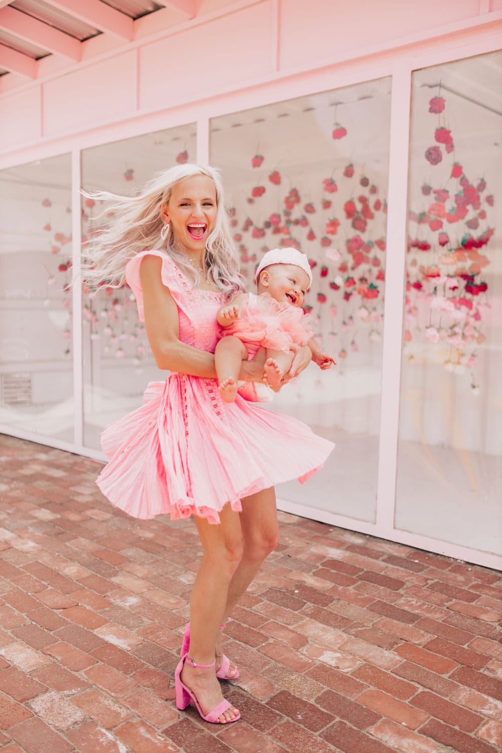 family photo ideas - mommy and me photography tips and poses - pink outfits and location - twirling pose