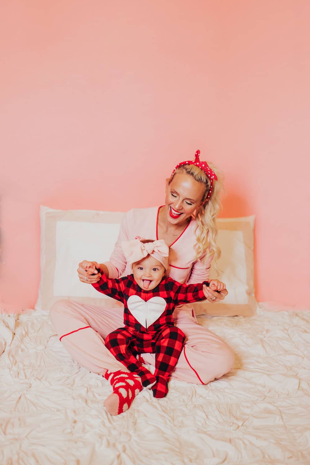 family photo ideas - mommy and me photography tips - at home photoshoot with pink paper backdrop - matching pajamas