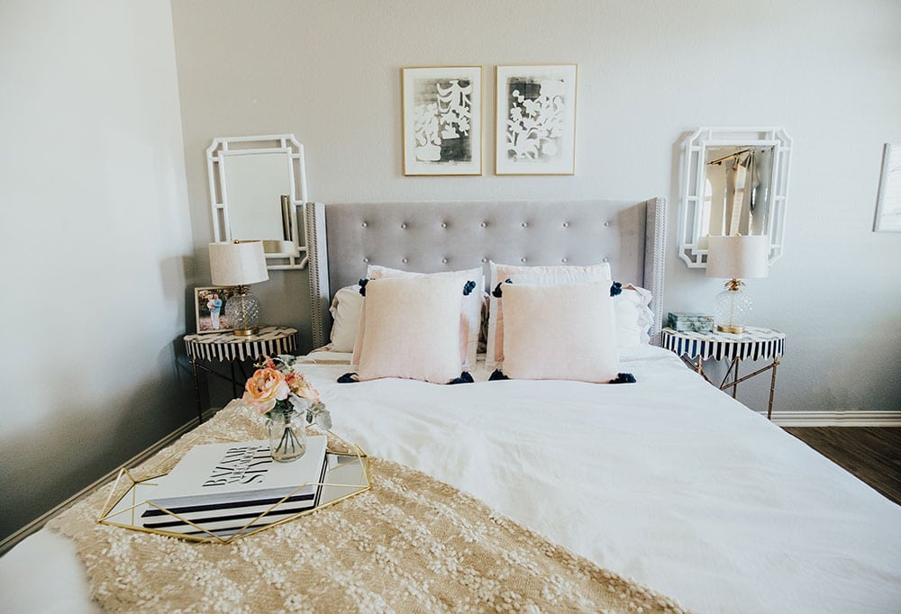 white bedding with pink throw pillows - master bedroom